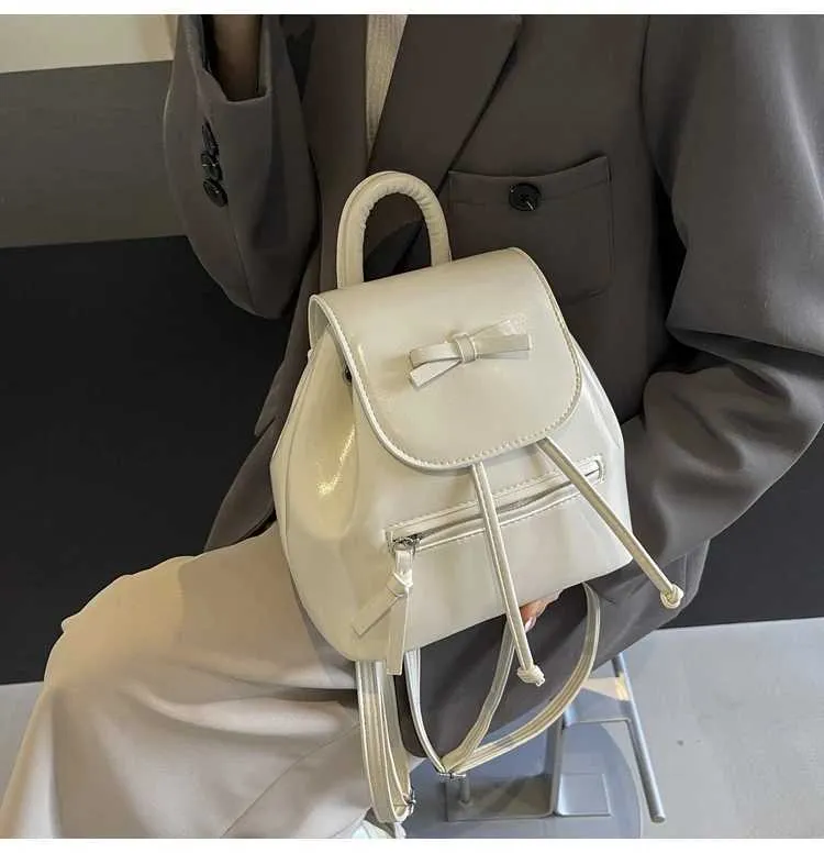 Mochila feminina sólida com aba e laços, mini bolsas de ombro, versátil, feminina, grande capacidade, bolsas de couro, casual, estudante_voghion.com