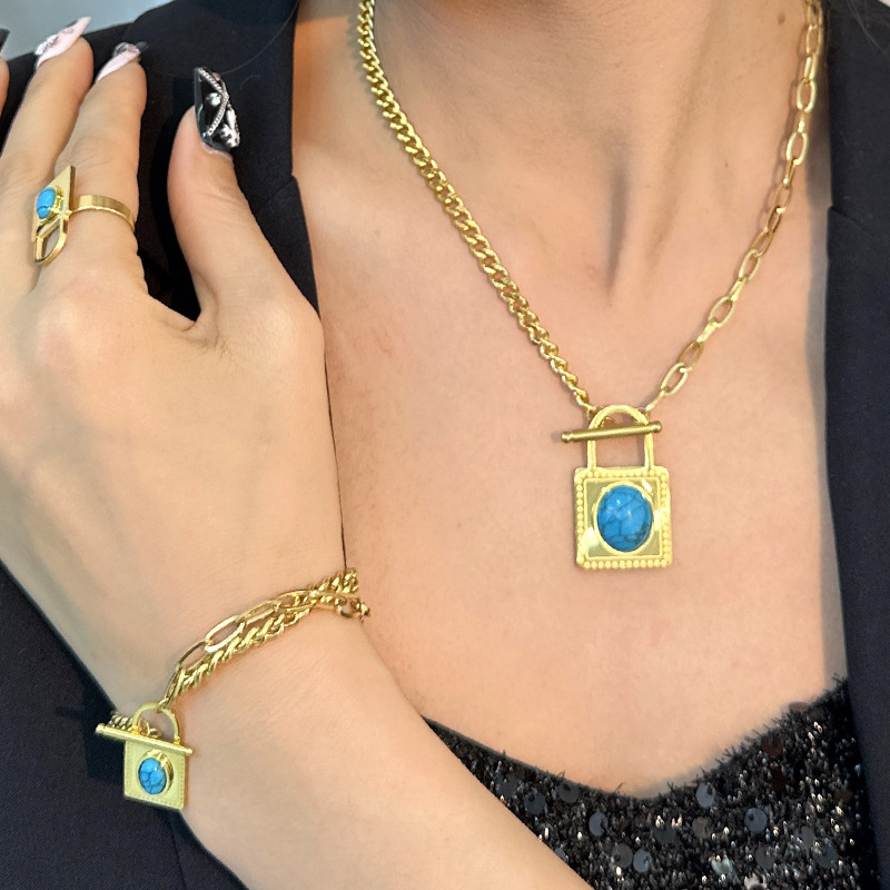Gute, nuovo design alla moda, collana con lucchetto turchese blu, bracciale in acciaio al titanio, set di quattro gioielli resistenti alla luce_voghion.com