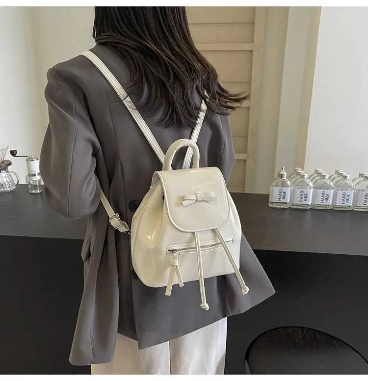 Mochila feminina sólida com aba e laços, mini bolsas de ombro, versátil, feminina, grande capacidade, bolsas de couro, casual, estudante_voghion.com