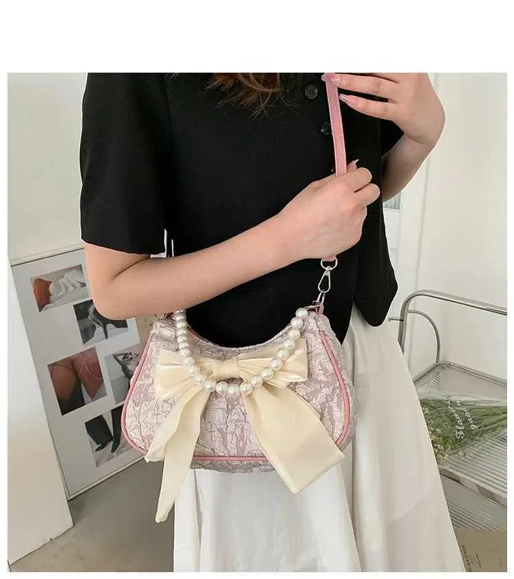 Bolsa de ombro e tiracolo feminina com pérolas e laço_voghion.com