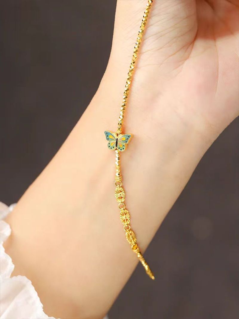 Prinsessan på flykten Bränd blå fjäril guldfärg blinkande laser trasigt Sier några få taels av disco pärlor armband_voghion.com