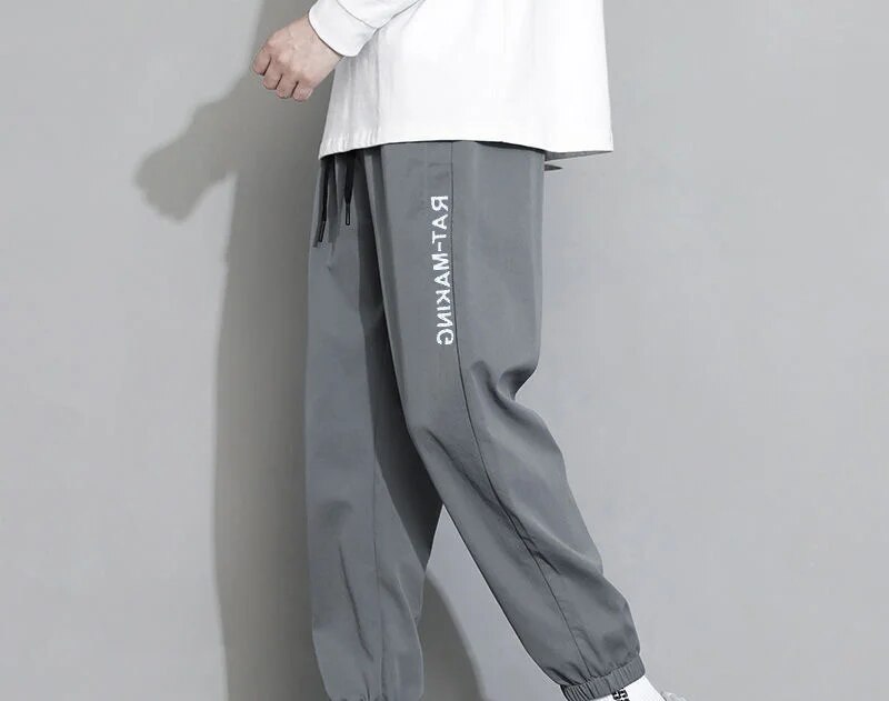 Ice Silk Pants for Men's Summer Thin, Loose, Trendy, Sports Versatile, Elastic, Quick Drying, Ultra Thin, 9-inch Casual Pants_voghion.com