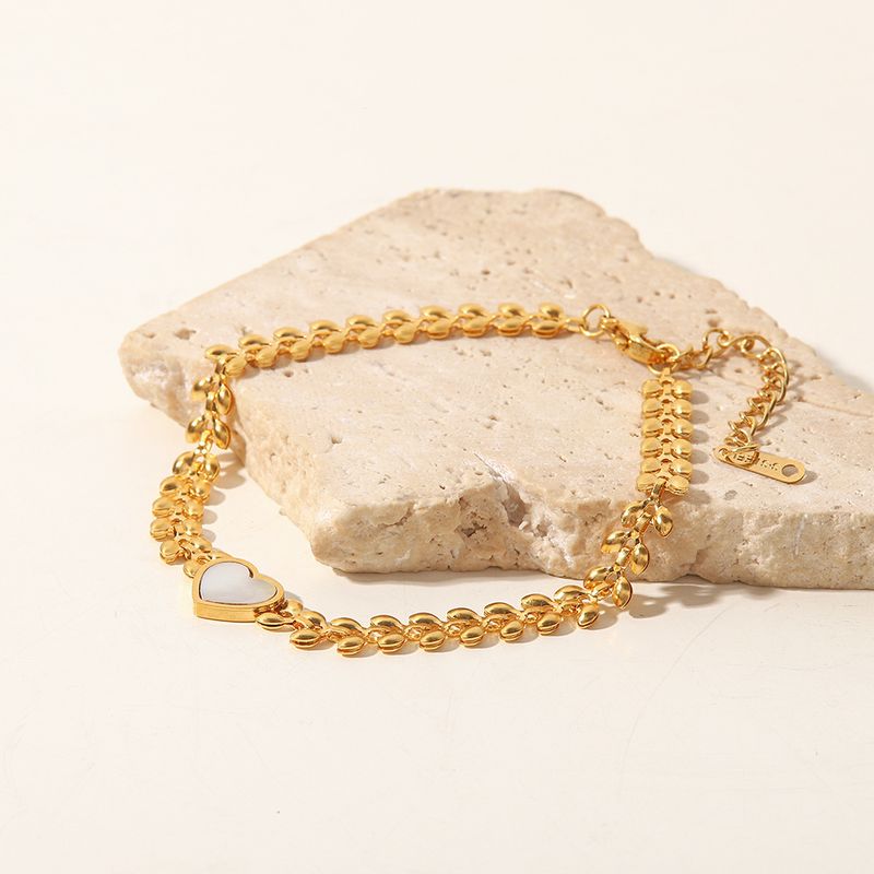 Ein Nischendesign mit hellen Weizenähren, weißen Muscheln, Liebesherzen und einem Armband aus Titanstahl, das nicht verblasst und cool ist_voghion.com