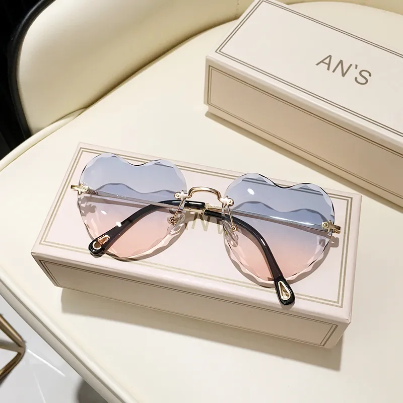 Hartvormige zonnebril dames randloze cat eye designer bril_voghion.com