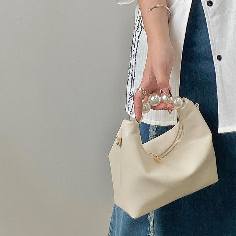 Petit sac à bandoulière de niche pour femmes avec un design de perles fraîches 2024 avec un sens de la chaîne et un sac à boulettes à main_voghion.com