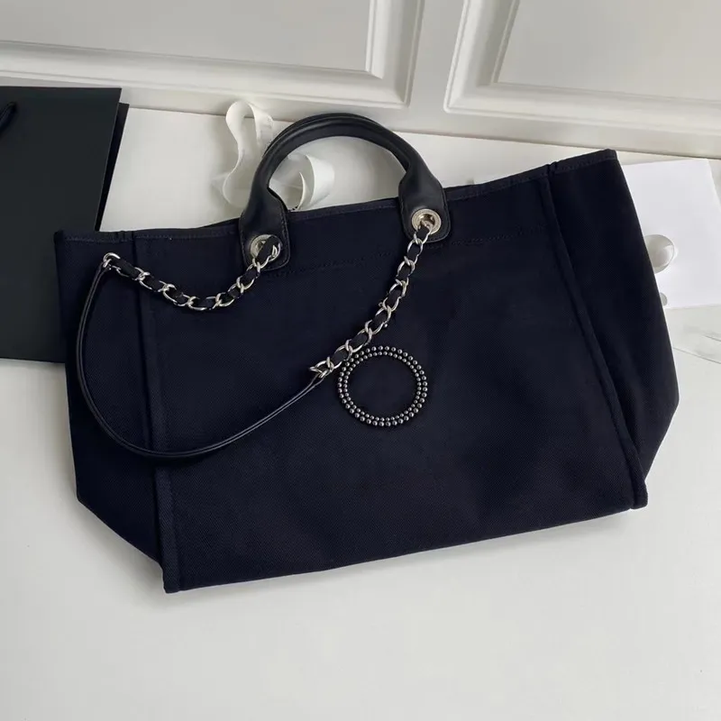 Designer-Tasche aus Segeltuch mit Perlengriff | Klassische Modehandtasche 2024_voghion.com