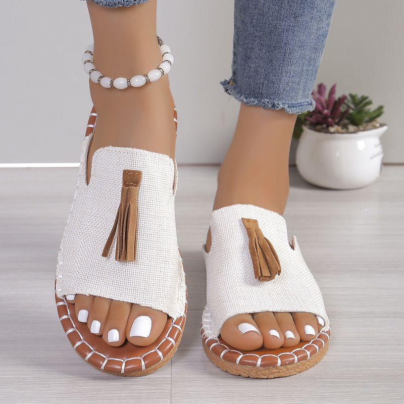 Pantofole da donna con punta aperta e nappe piatte alla moda_voghion.com